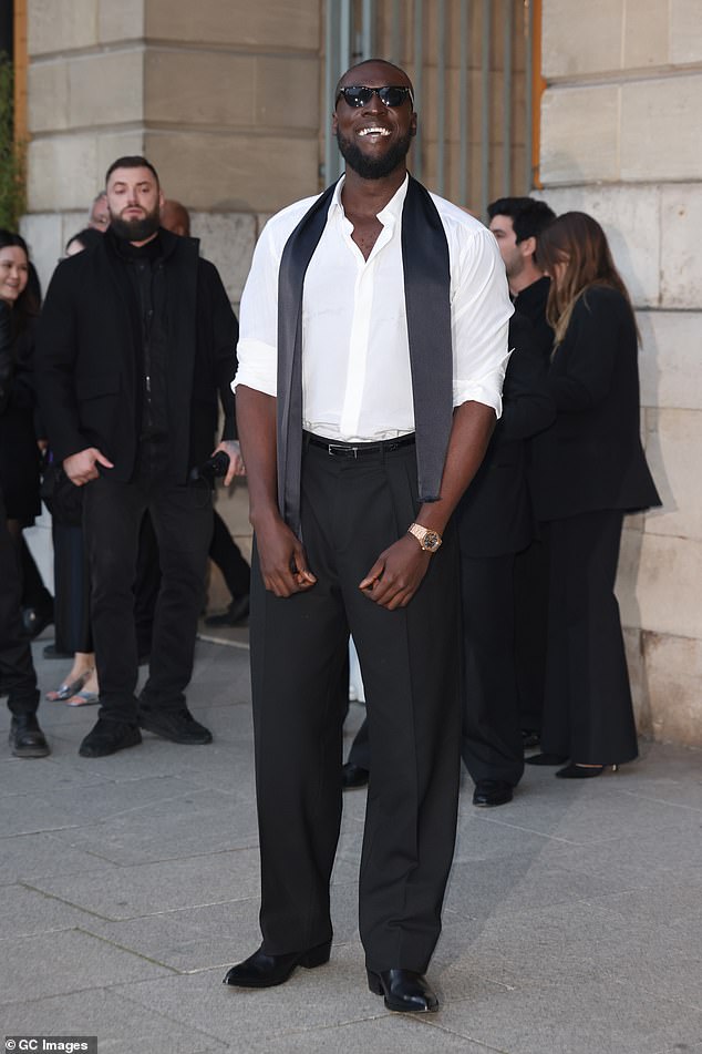Grime superstar Stormzy also showed off his snazzy sense of style in a sharp white shirt and black trousers