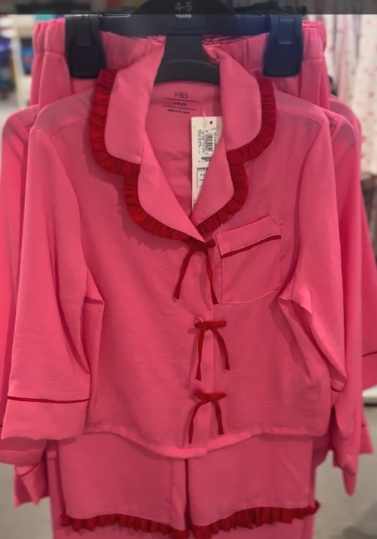M&S kids' pyjamas in pink with red ruffled trim.