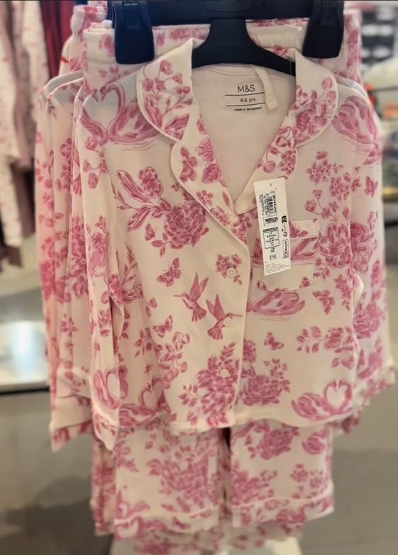 M&S kids' pyjamas in white with a pink floral, hummingbird, and swan pattern.