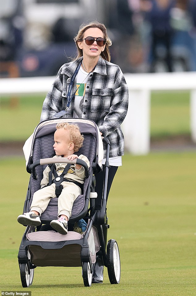 The model is pictured with the couple's two-year-old son, Crew, in Scotland last week