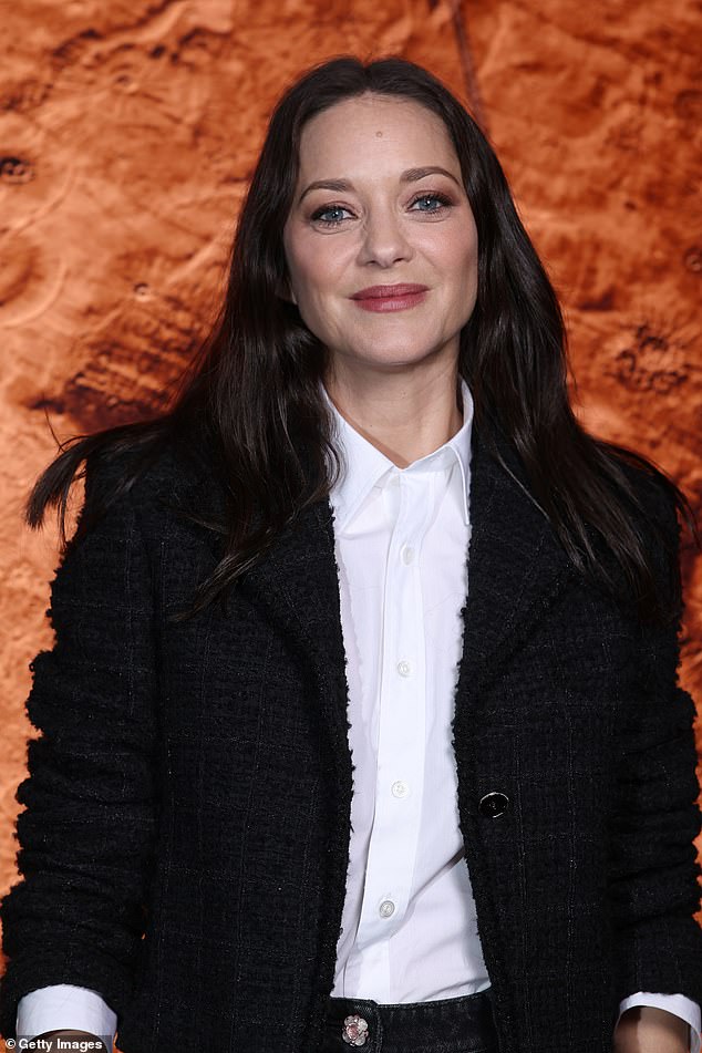 She teamed the jacket with a crisp white shirt