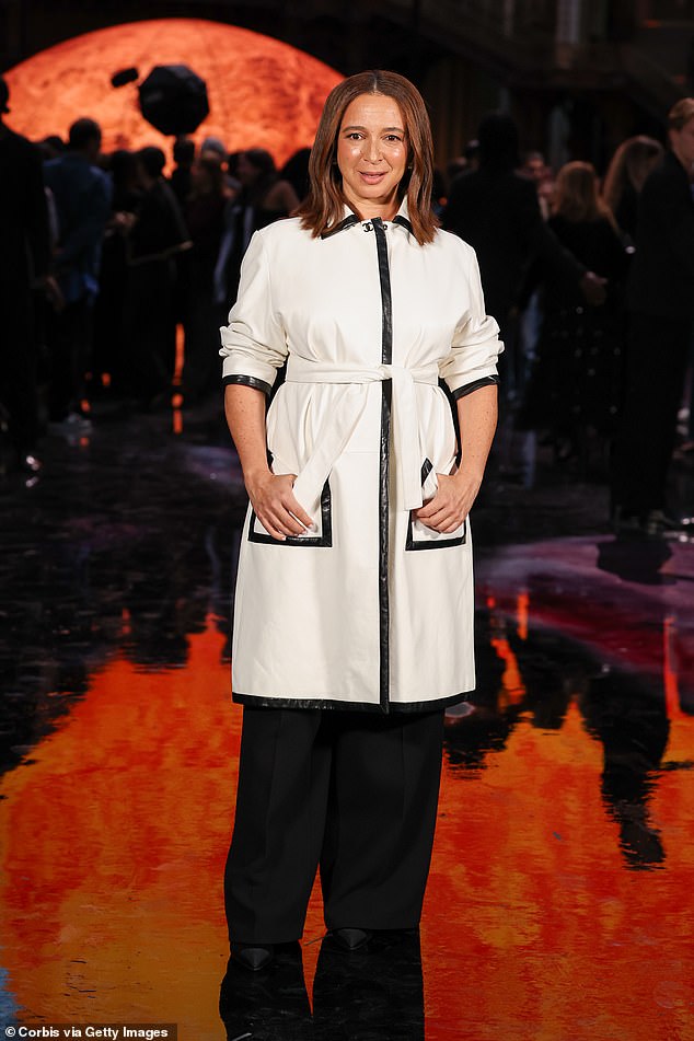 Maya wore a chic white coat for the show