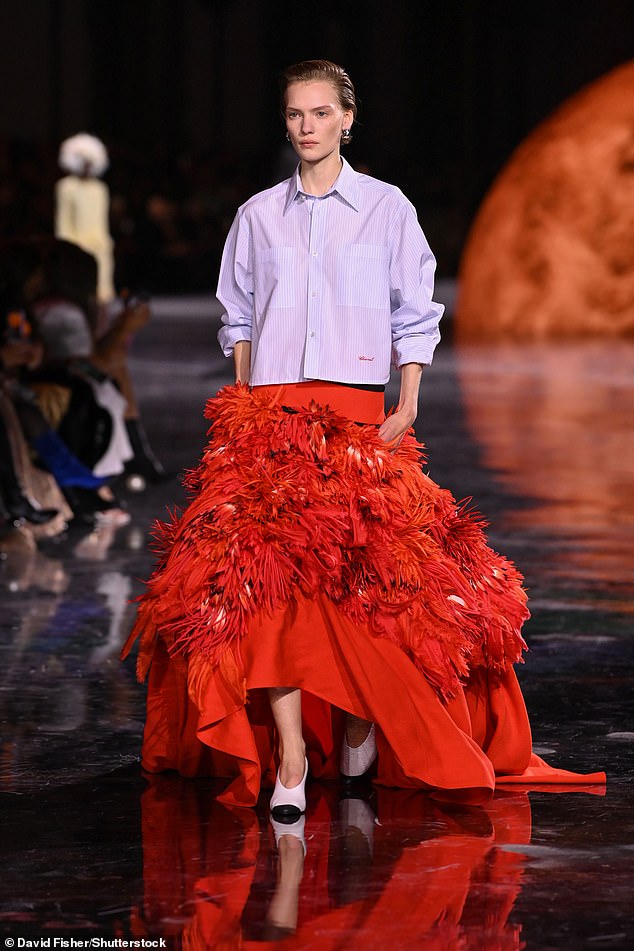 The incredible runway show took place against an eye-catching solar system-themed backdrop