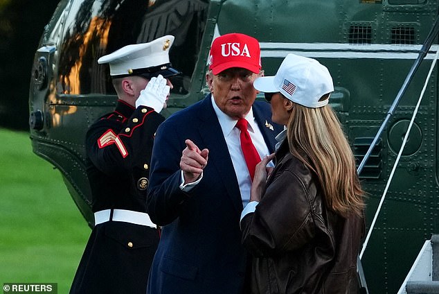 Donald and Melania Trump speak as they arrive at the White House on October 5