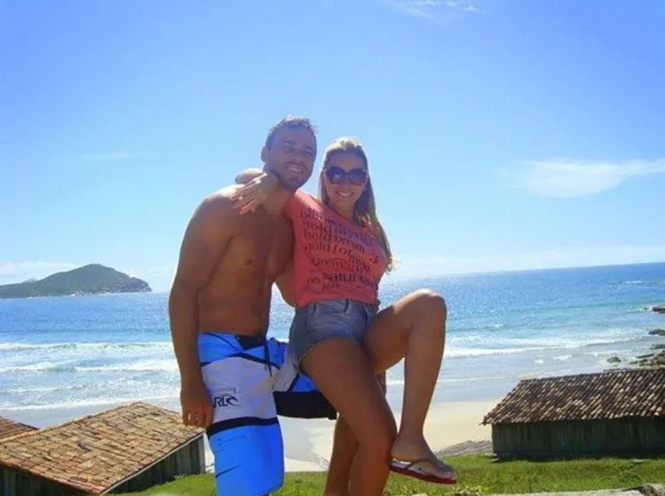Ana and Jeferson pose in front of a beach in Sao Jose, Brazil.
