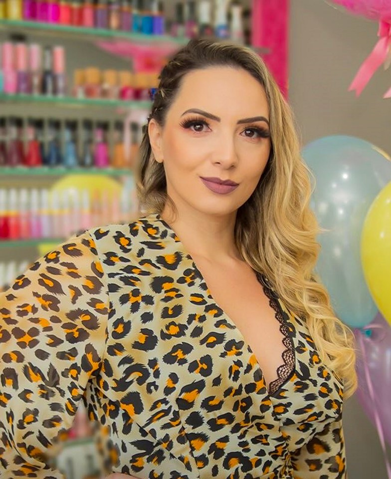 Ana Carolina Silva wearing a leopard print top.