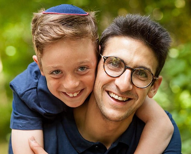 Yoni Finlay (right) saved lives by helping to barricade the door of Heaton Park Hebrew Congregation Synagogue during Thursday's terrorist attack, his son Uriel (now 15) said