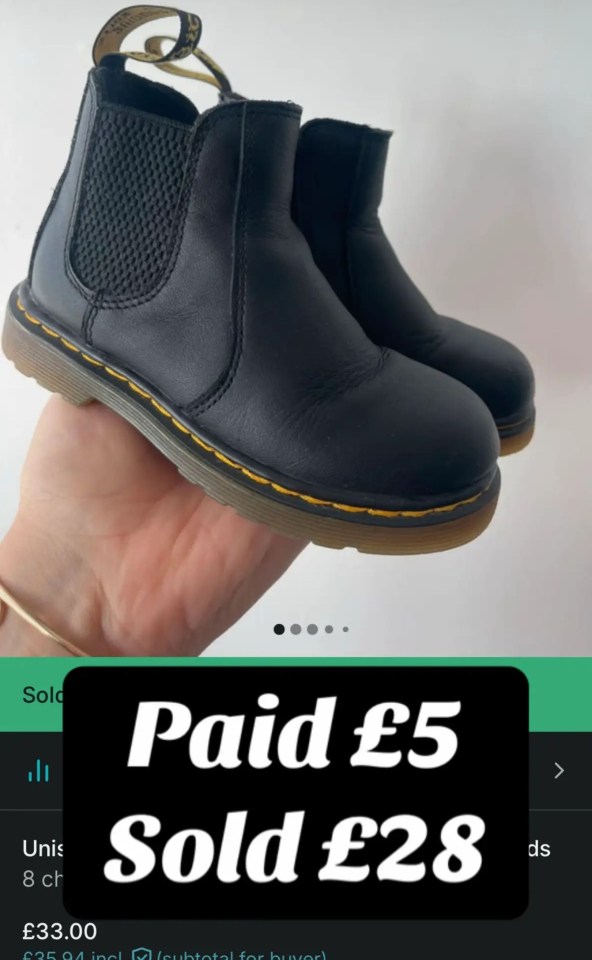 A pair of black boots with yellow stitching, showing an original purchase price of £5 and a selling price of £28.