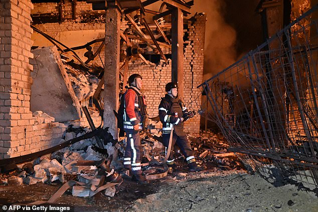 Ukrainian rescuers work among the rubble at an energy infrastructure facility following a drone attack in Kharkiv on October 7, 2025, amid the Russian invasion of Ukraine