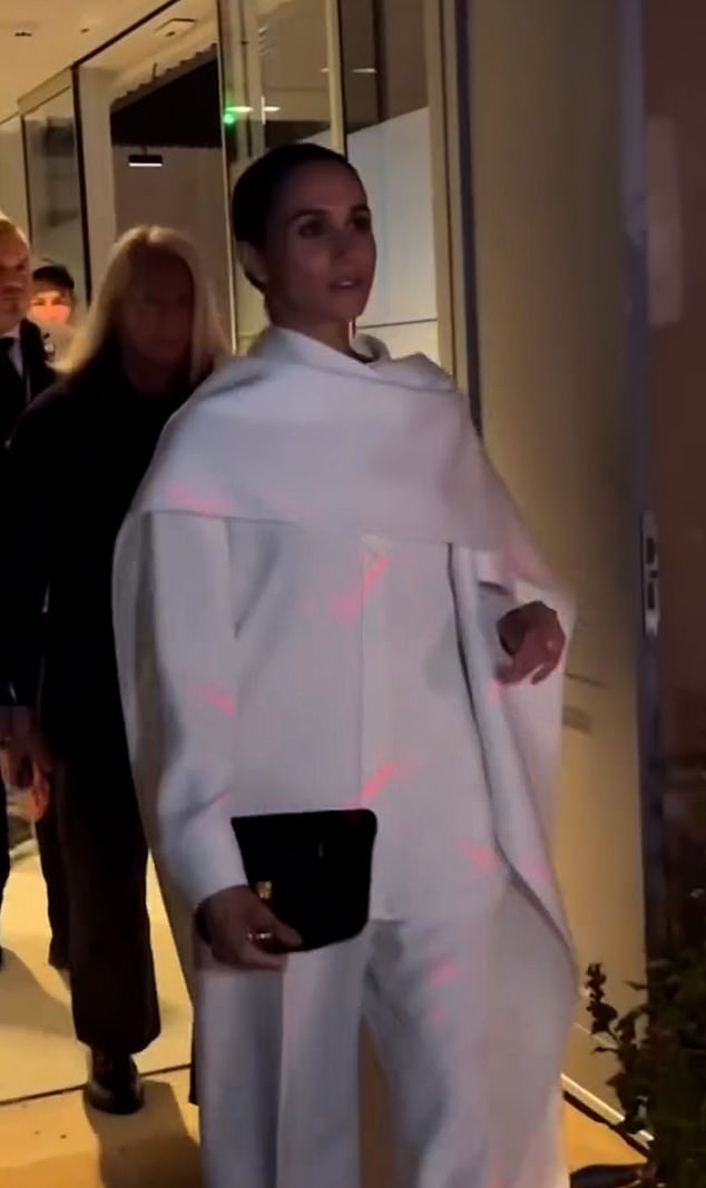 It appears Meghan had her own model moment as she strutted in front of numerous cameras while exiting the star-studded Balenciaga show in Paris this weekend