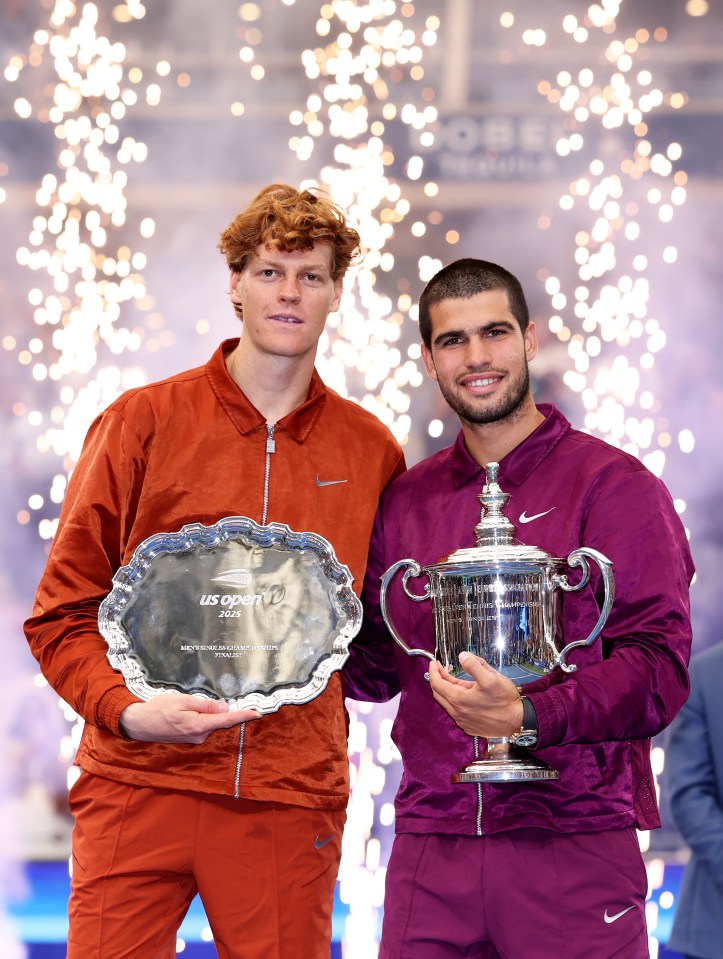 Jannik Sinner and Carlos Alcaraz pose with their trophies after the Men's Singles Final at the 2025 US Open.