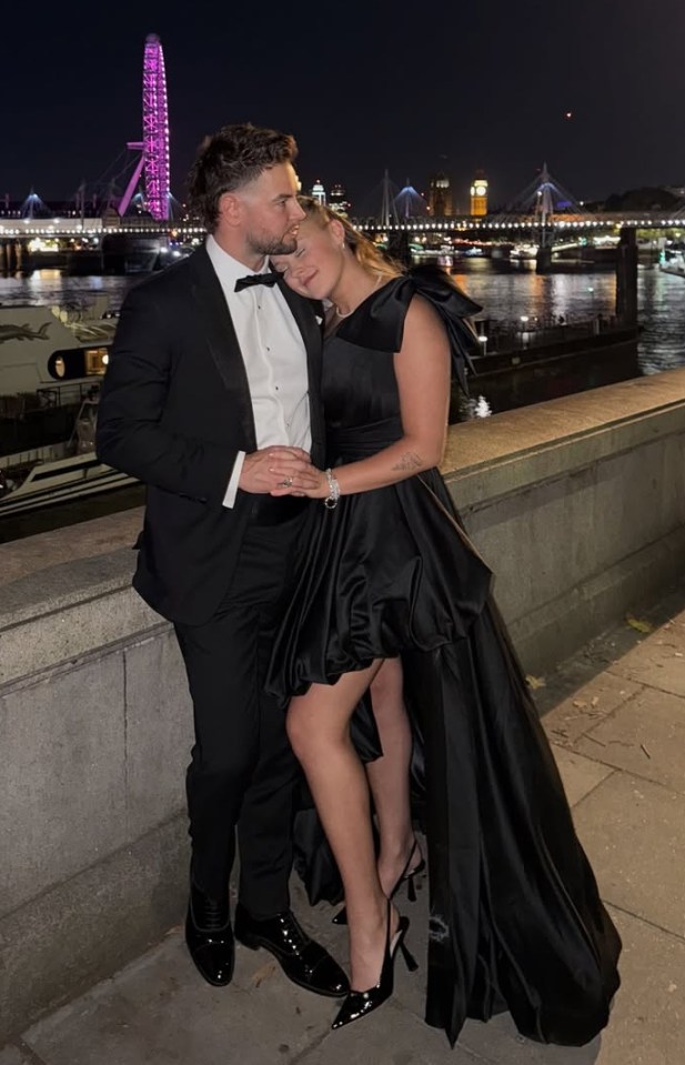 Jojo Siwa in a black thigh-split dress with Chris Hughes at a wedding.