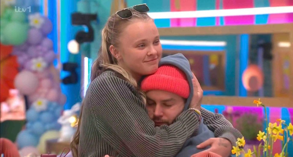 JoJo Siwa cuddling Chris Hughes.