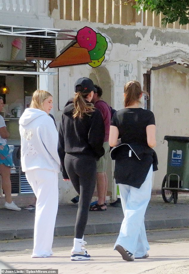 The group walked past an ice cream shop during the outing