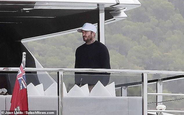 David wore a trendy white cap and black crew-neck jumper