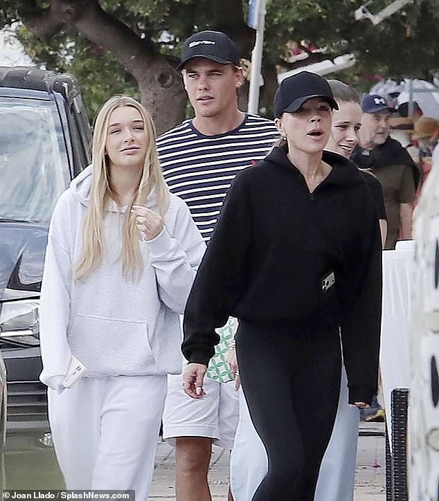 Harper and Victoria went for contrasting ensembles in black and white