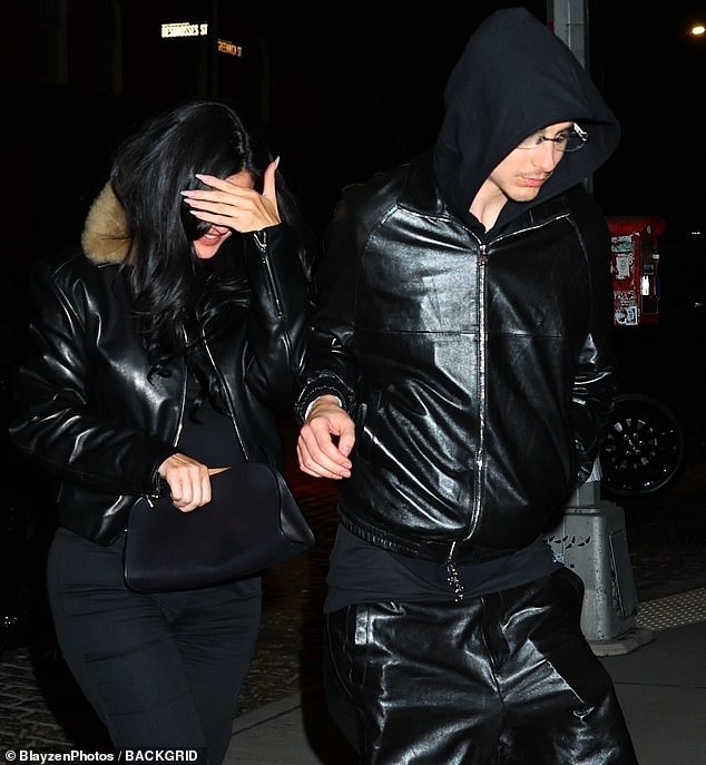 They kept their heads down as Jenner even put a hand over her face as she smiled from ear to ear