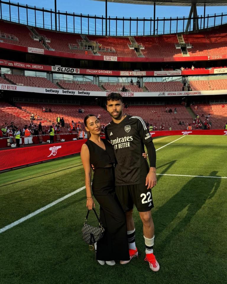David Raya with his girlfriend Tatiana Trouboul on the field of Emirates Stadium.