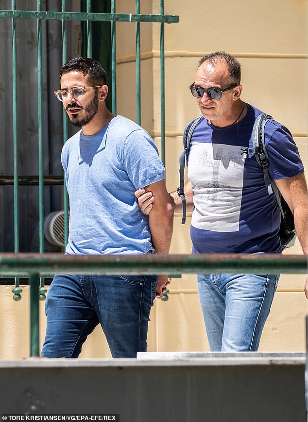 Hayut (L) is extradited to Israel from Athens in July 2019 after landing on a false passport