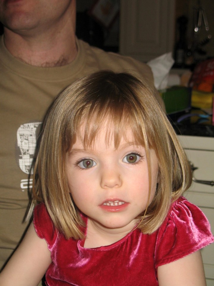 Madeleine McCann, a young girl with blonde hair and a red velvet dress, looks directly at the camera.