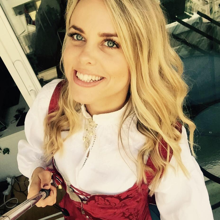 Cecilie Fjellhøy smiles while holding a selfie stick.