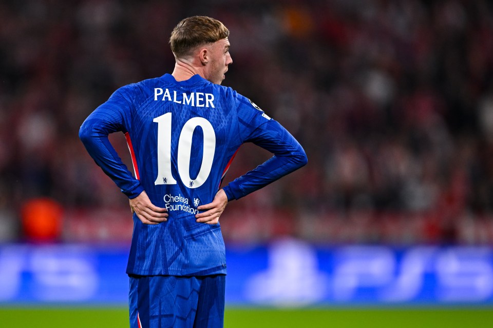 Cole Palmer of Chelsea FC wearing jersey number 10, hands on his hips, looks over his right shoulder.