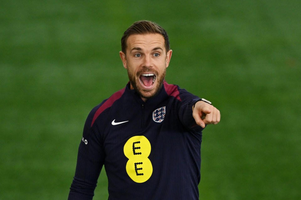 Jordan Henderson reacts during an England training session.