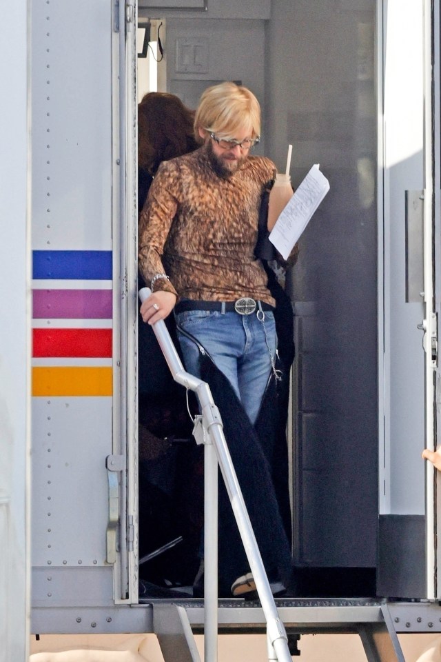 Jonah Hill in a leopard print top, shaggy blonde hair, and jeans on the set of "Cut Off."