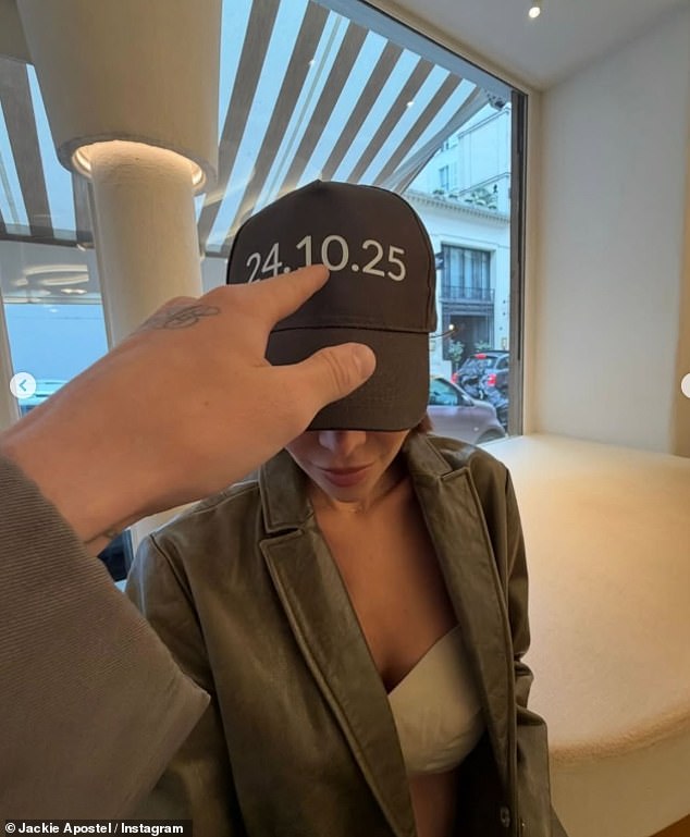 Taking to her own Instagram, Jackie shared a snap of the pairs feet as well as a zoomed in picture of her hat, which read the date '24.10.25