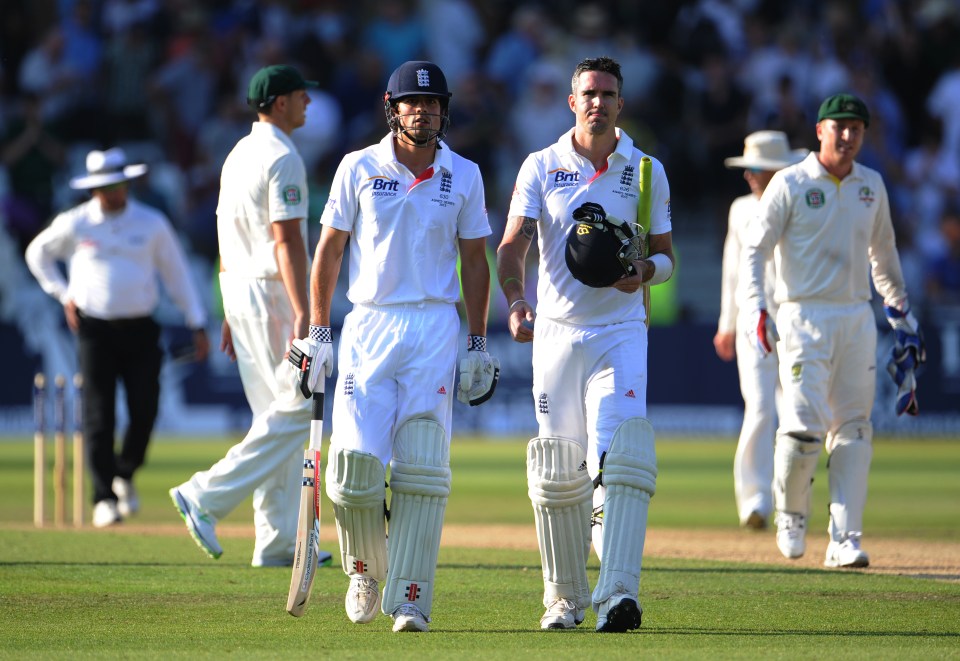 Alastair Cook and Kevin Pietersen of England leaving the field during the Ashes Test match.