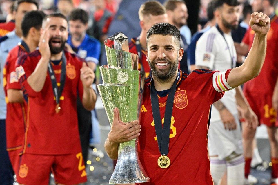 Spain's midfielder Jordi Alba holding the UEFA Nations League Cup.