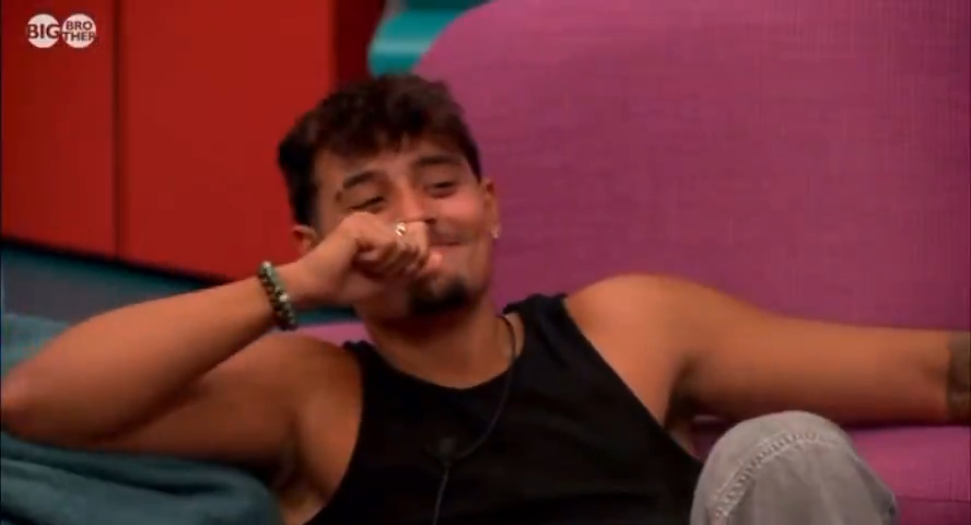 Big Brother contestant Zelah smiling and covering his mouth.
