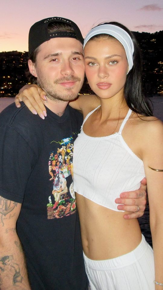 Brooklyn Beckham and Nicola Peltz embracing each other.