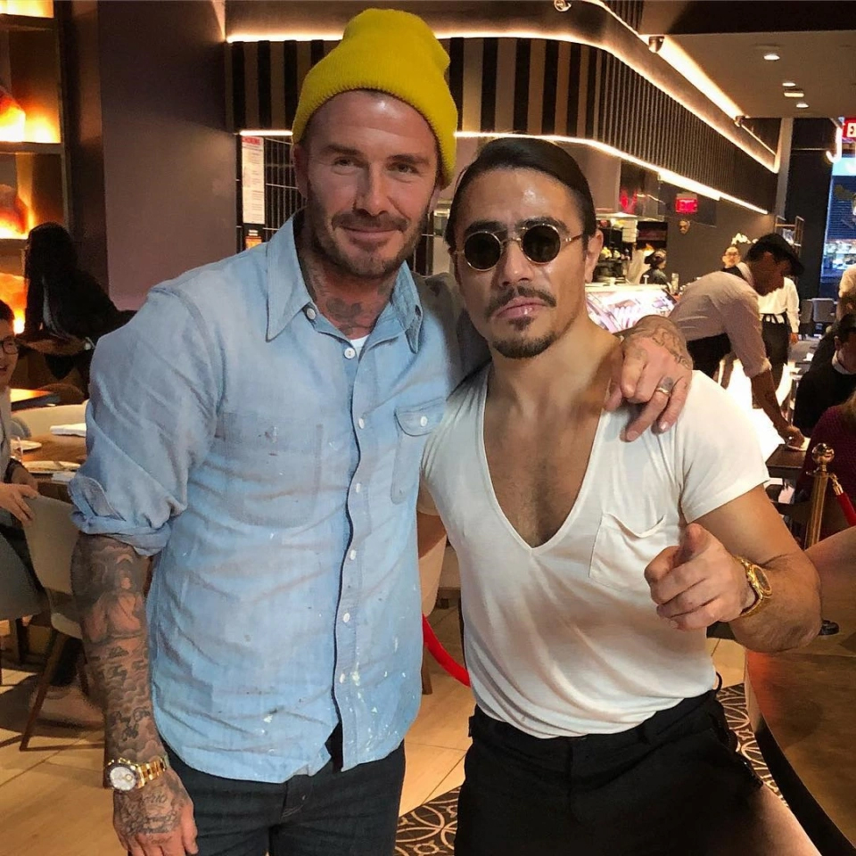 David Beckham and Nusret Gökçe, also known as Salt Bae, posing together.