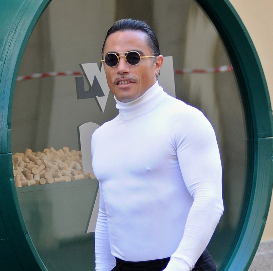 Salt Bae (Nusr-Et Gökçe), a Turkish restaurateur, wearing a white turtleneck and sunglasses.