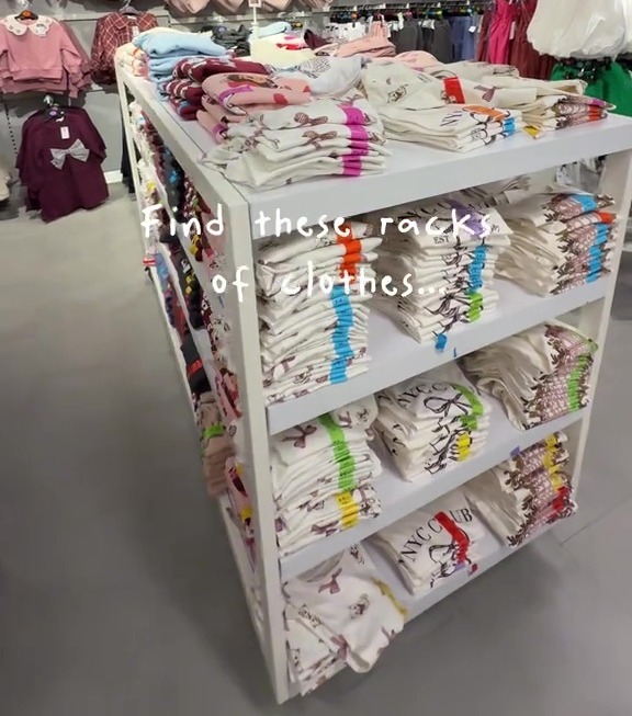 Clothes racks in a Primark store.
