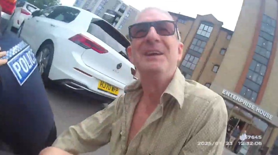 Video still of Jeff Stewart restraining a shoplifting suspect.