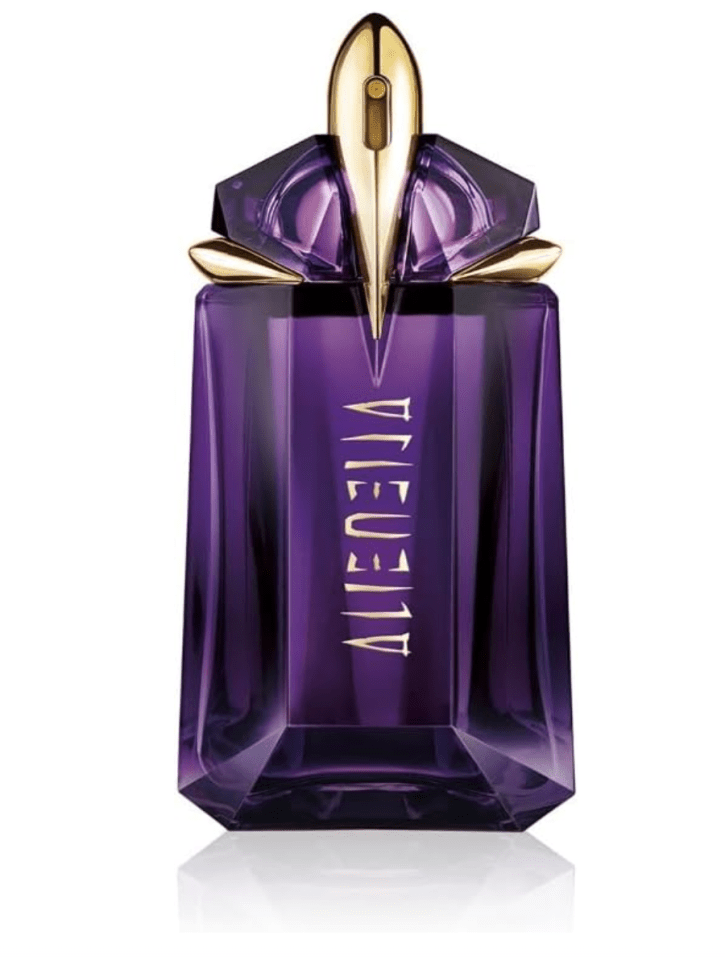 Mugler Alien perfume bottle with a purple crystal design and gold-colored top.