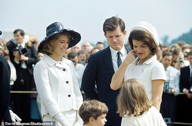 Ted Kennedy, Joan Bennett Kennedy, Jackie Kennedy Onassis, John Kennedy Jr and Caroline Kennedy are pictured together at the 1965 JFK memorial in Runnymede, Britain