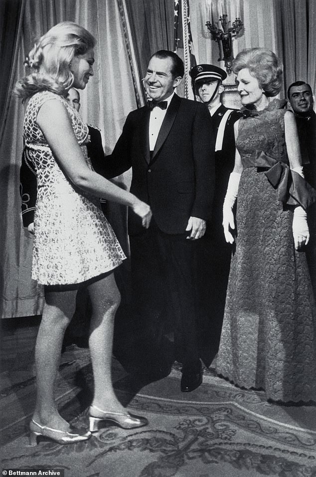Joan Kennedy, wife of Senator Edward Kennedy, is welcomed by President and First Lady Nixon to the second of three receptions for members of Congress at the White House in 1969