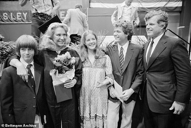 Joan Kennedy (second from left), dressed in cap and gown, poses with her family after receiving her Master's degree in Education from Lesley College in 1981