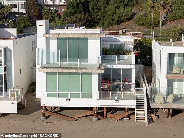 An oceanfront Malibu home owned by the socialite was 'burned to a crisp.' Pictured before the fires