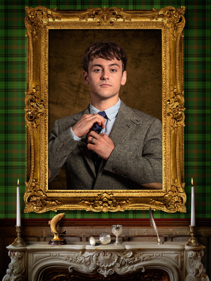 Tom Daley in a golden frame, adjusting his tie, above a fireplace with candles.