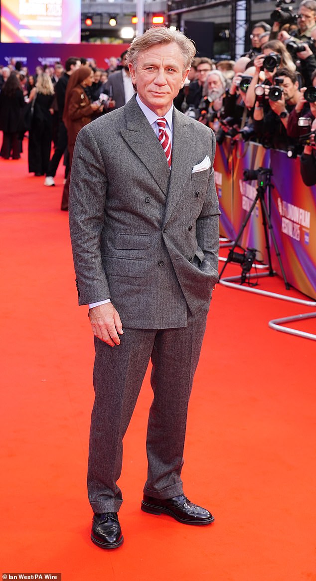 Daniel appeared to trade in his usually slicked silver locks for a wiry voluminous look, paired with his grey tweed double-breasted suit