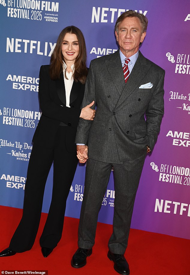 Rachel opted for a black satin blazer with a pair of flared trousers, as well as a white open-neck shirt and stilettos