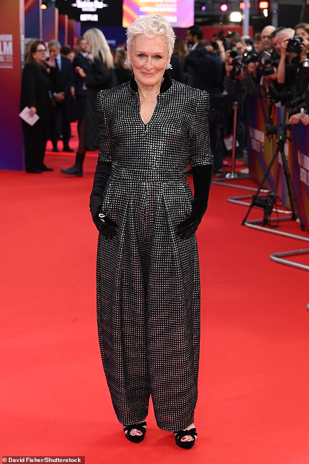 She paired the look with velvet elbow-length gloves, open-toed platform heels and an array of silver jewellery