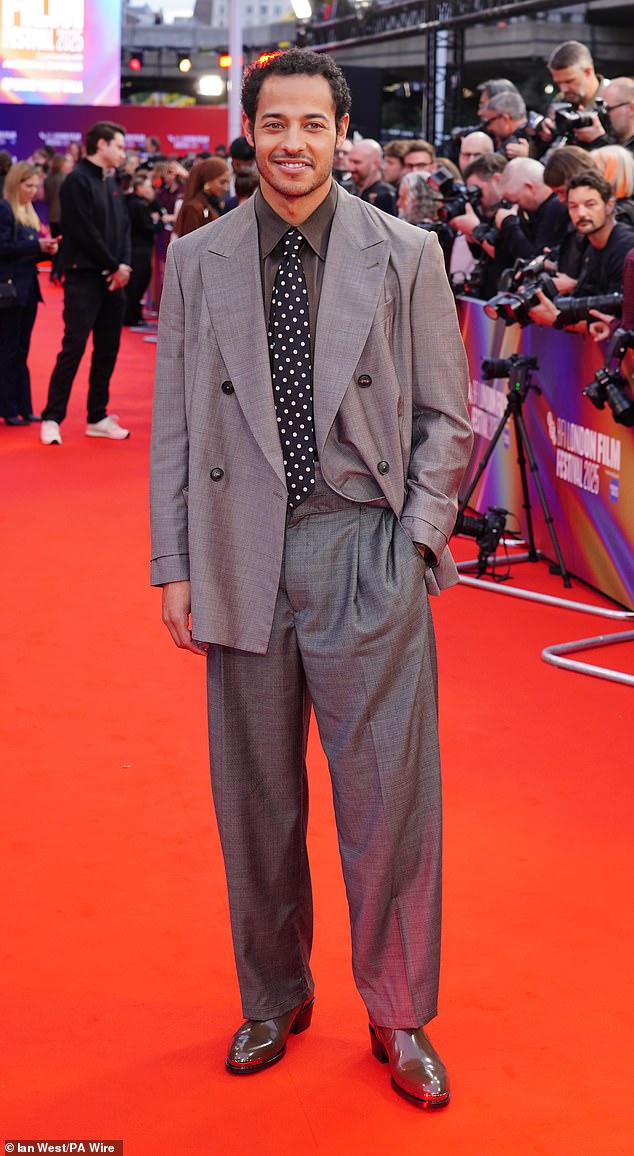 Daryl McCormack looked stylish in a grey oversized suit paired with a dark green shirt and black and white polka dot tie