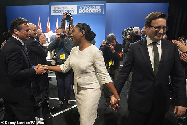 Mrs Badenoch, flanked by her husband Hamish, said the move would mean first-time buyers, growing families and pensioners looking to downsize would no longer be 'punished' by the tax