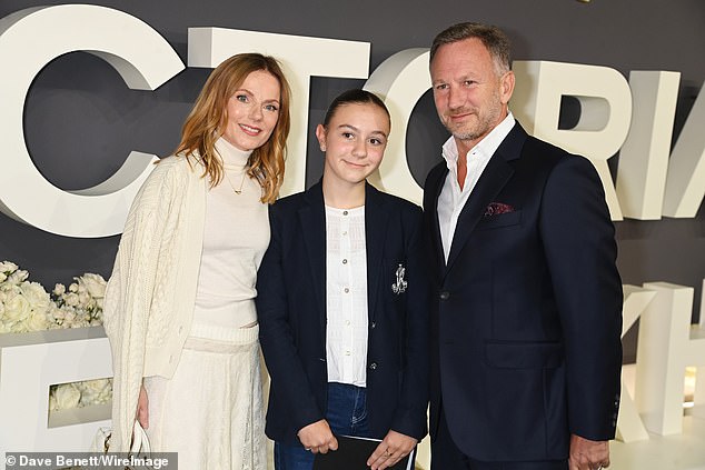 Geri opted for her signature white uniform for the premiere, wearing a roll neck sweater with a cable knit cardigan and a lace sheer maxi skirt