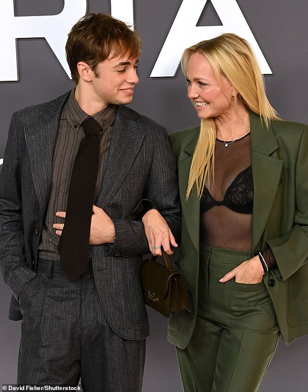 Opting to complete the look with a sheer top that exposed her black lace bra, Emma inevitably commanded attention while making a rare red carpet appearance with son Beau